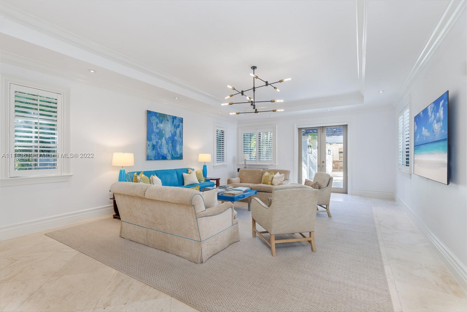 8230 Southwest 53rd Avenue Miami, FL 33143 - Photo 15 of 34 a living room with furniture and a chandelier