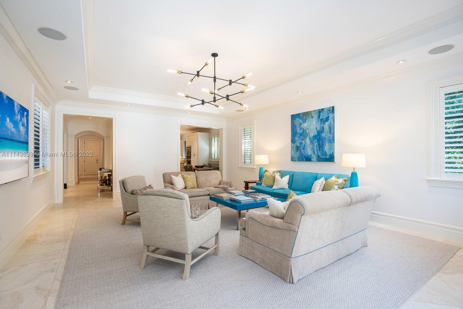 8230 Southwest 53rd Avenue Miami, FL 33143 - Photo 16 of 34 a living room with furniture and a chandelier