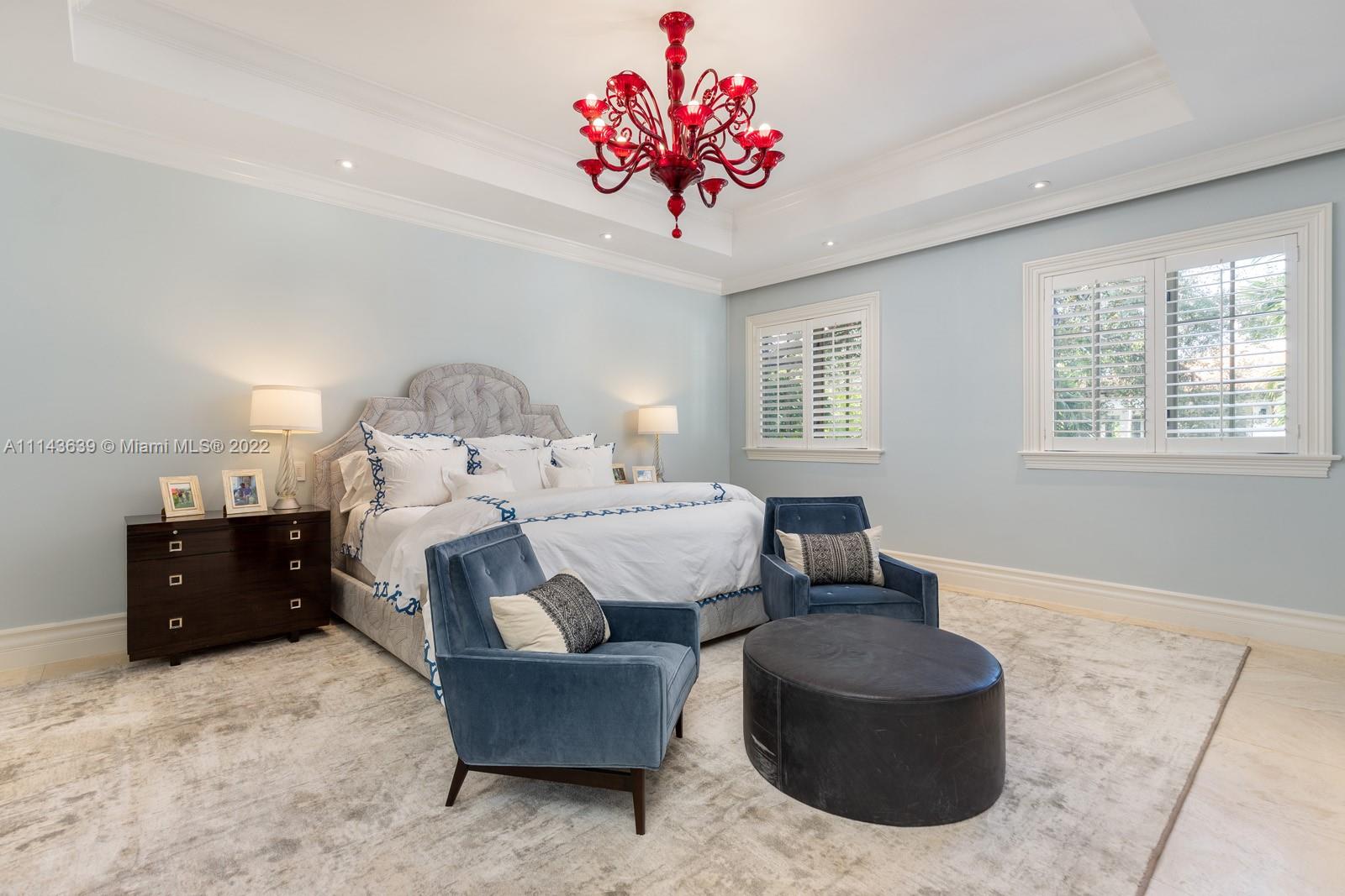 8230 Southwest 53rd Avenue Miami, FL 33143 - Photo 19 of 34 a living room with furniture and a chandelier