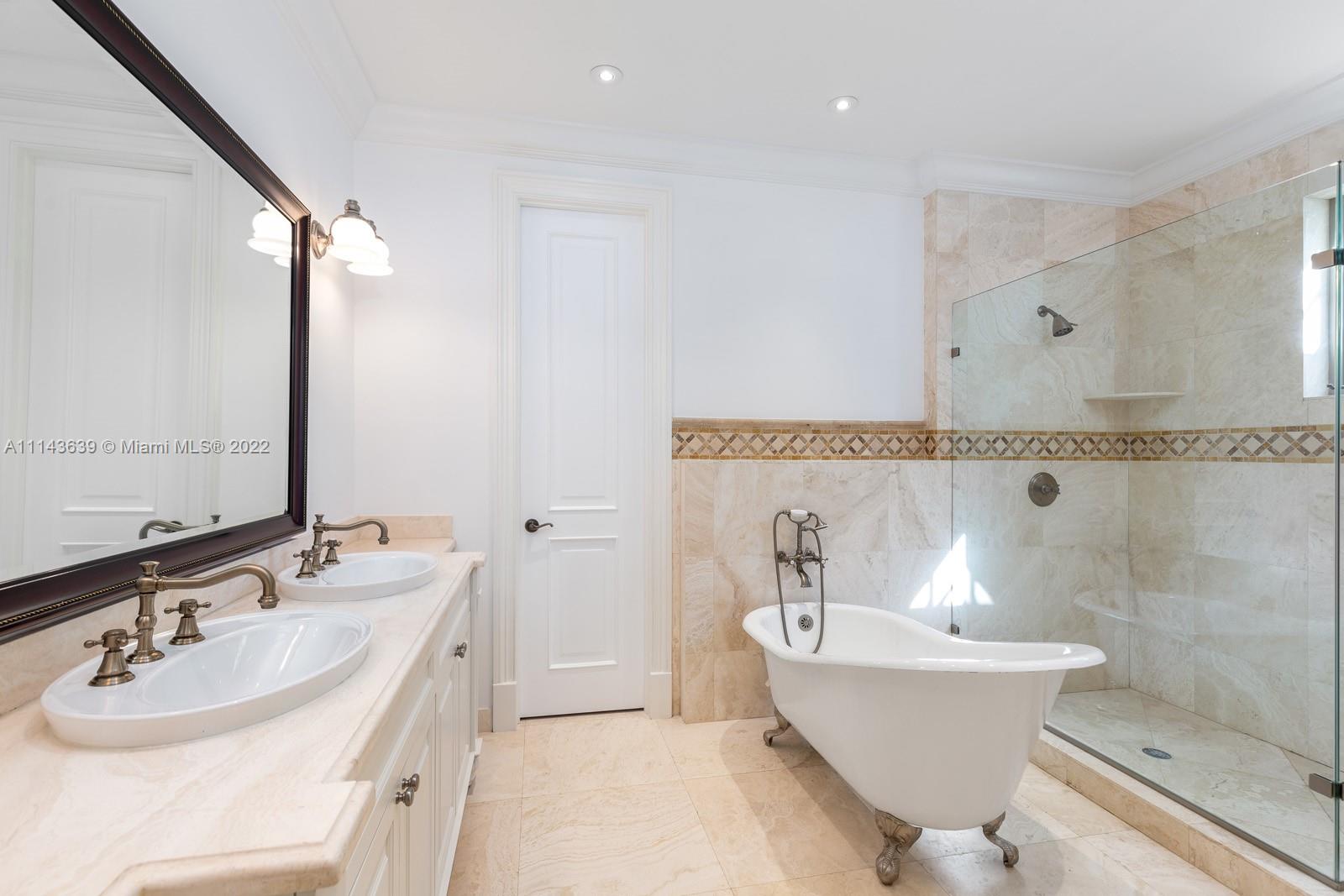 8230 Southwest 53rd Avenue Miami, FL 33143 - Photo 23 of 34 a bathroom with a sink and a mirror