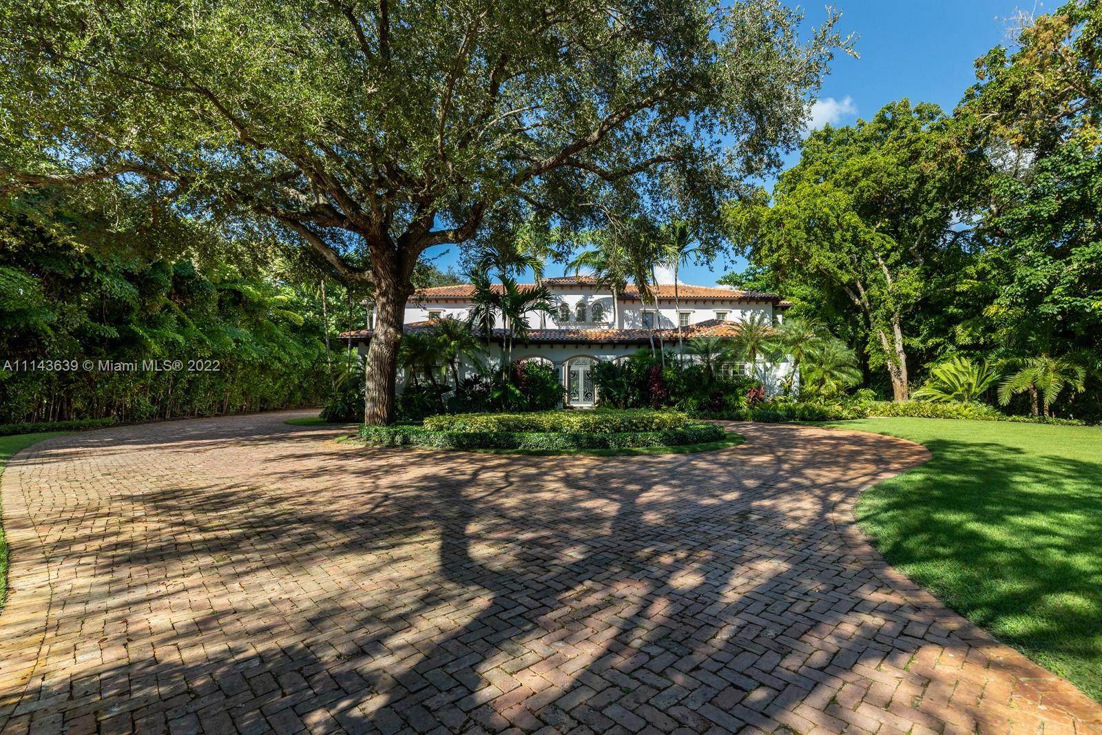 8230 Southwest 53rd Avenue Miami, FL 33143 - Photo 4 of 34 a front view of a house with yard and green space