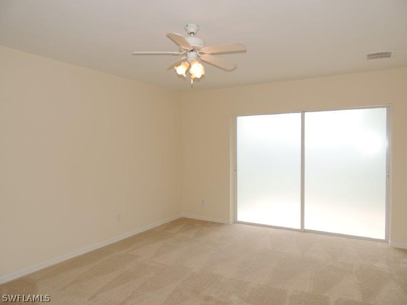 17416 Kentucky Road Fort Myers, FL 33967 - Photo 5 of 13 a view of an empty room with a window