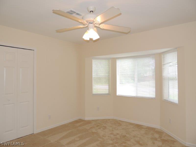 17416 Kentucky Road Fort Myers, FL 33967 - Photo 8 of 13 a view of an empty room with a window