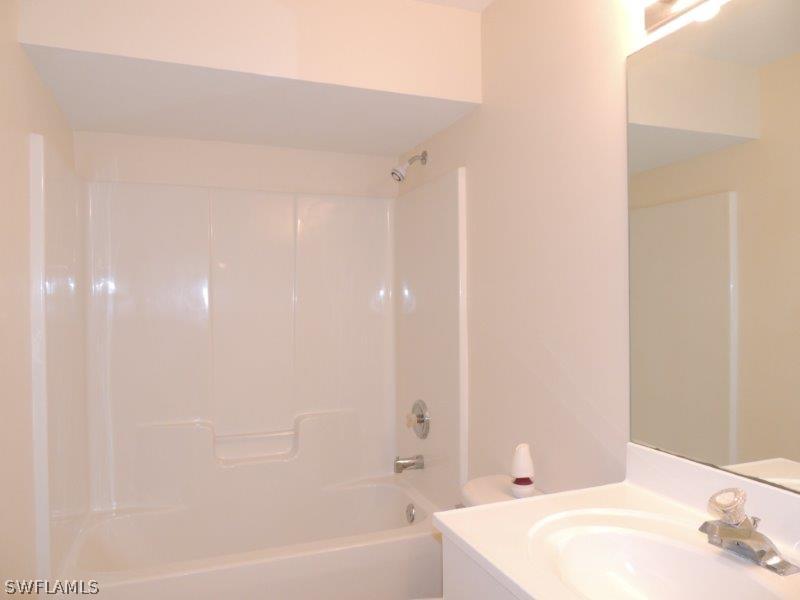 17416 Kentucky Road Fort Myers, FL 33967 - Photo 9 of 13 a bathroom with a bathtub and shower