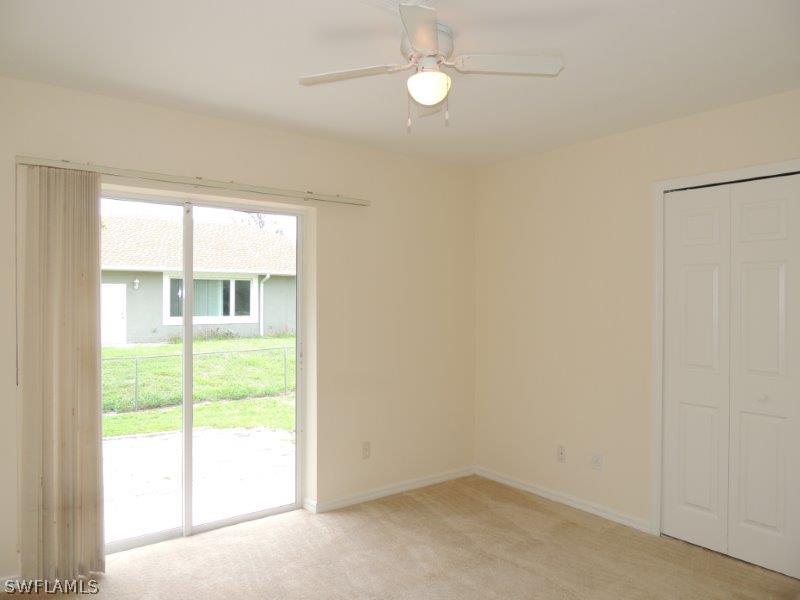 17416 Kentucky Road Fort Myers, FL 33967 - Photo 10 of 13 an empty room with a window
