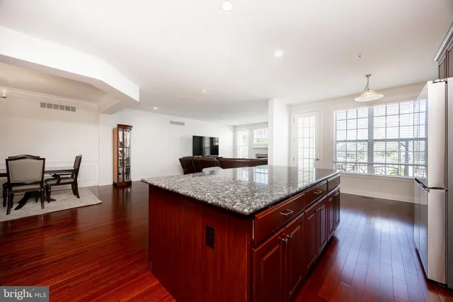 a kitchen with counter space and breakfast area