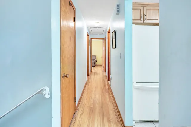 a view of a bathroom from a hallway