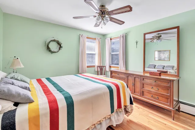 a bedroom with a bed and window