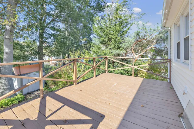 a view of balcony with deck and wooden floor