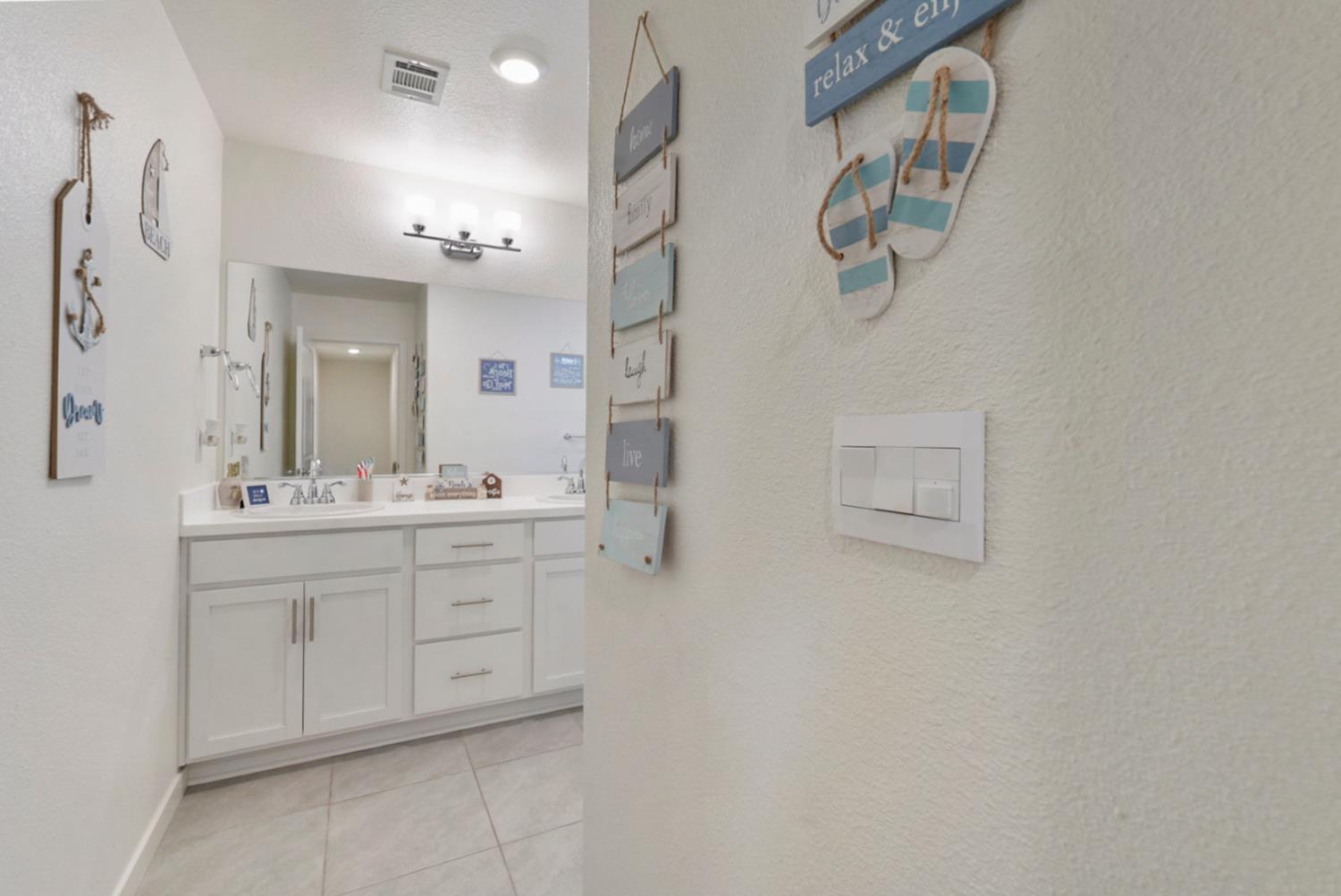 377 Shafer Avenue Merced, CA 95348 - Photo 15 of 36 a bathroom with a double vanity sink mirror and