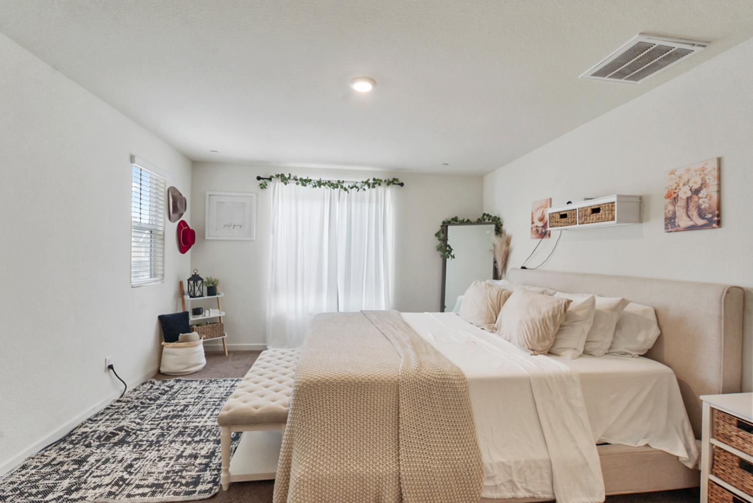 377 Shafer Avenue Merced, CA 95348 - Photo 17 of 36 a bedroom with a bed and a window