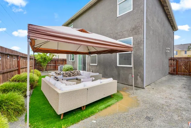 a white house with a large outdoor space