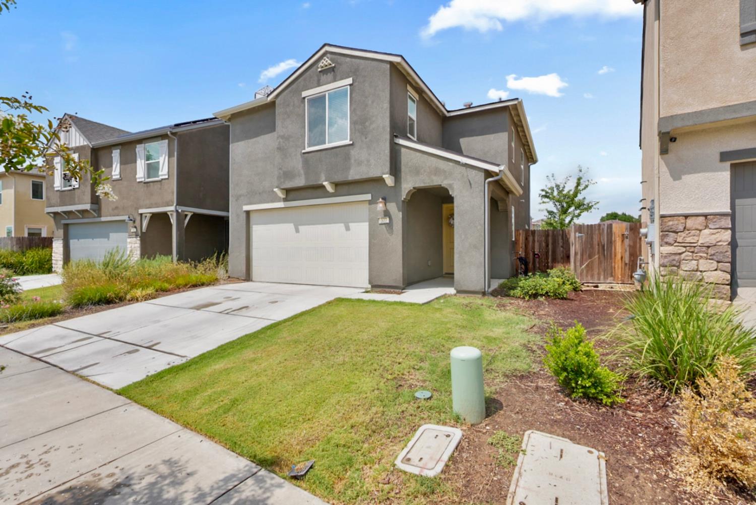 377 Shafer Avenue Merced, CA 95348 - Photo 3 of 36 a front view of a house with garden