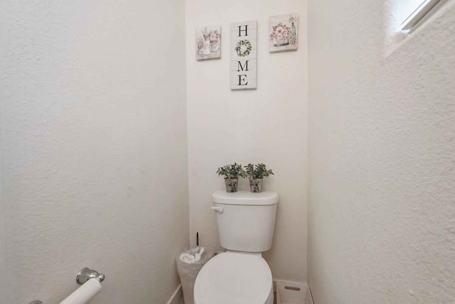 377 Shafer Avenue Merced, CA 95348 - Photo 5 of 36 a white toilet sitting next to a white wall