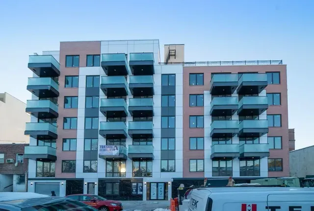 a front view of a building with a street