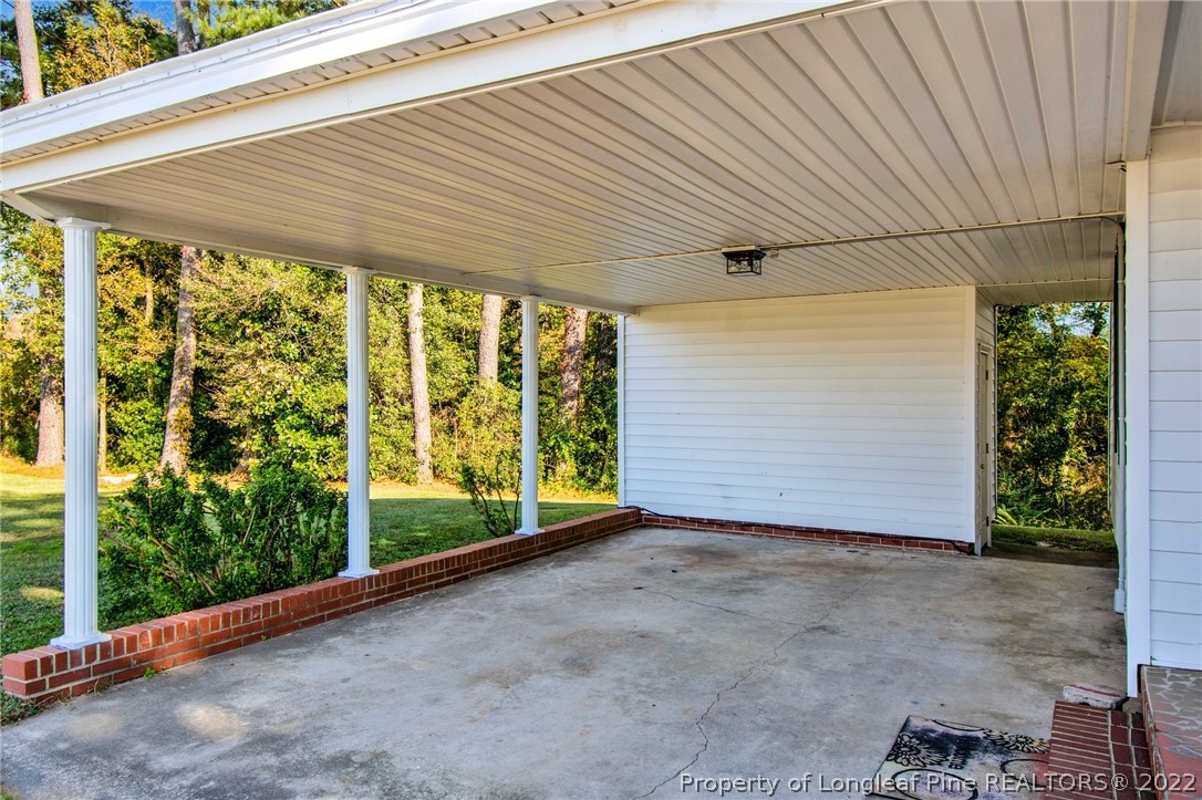 6474 Sisk Culbreth Road Godwin, NC 28344 - Photo 3 of 23 a view of a room with wooden floor and roof
