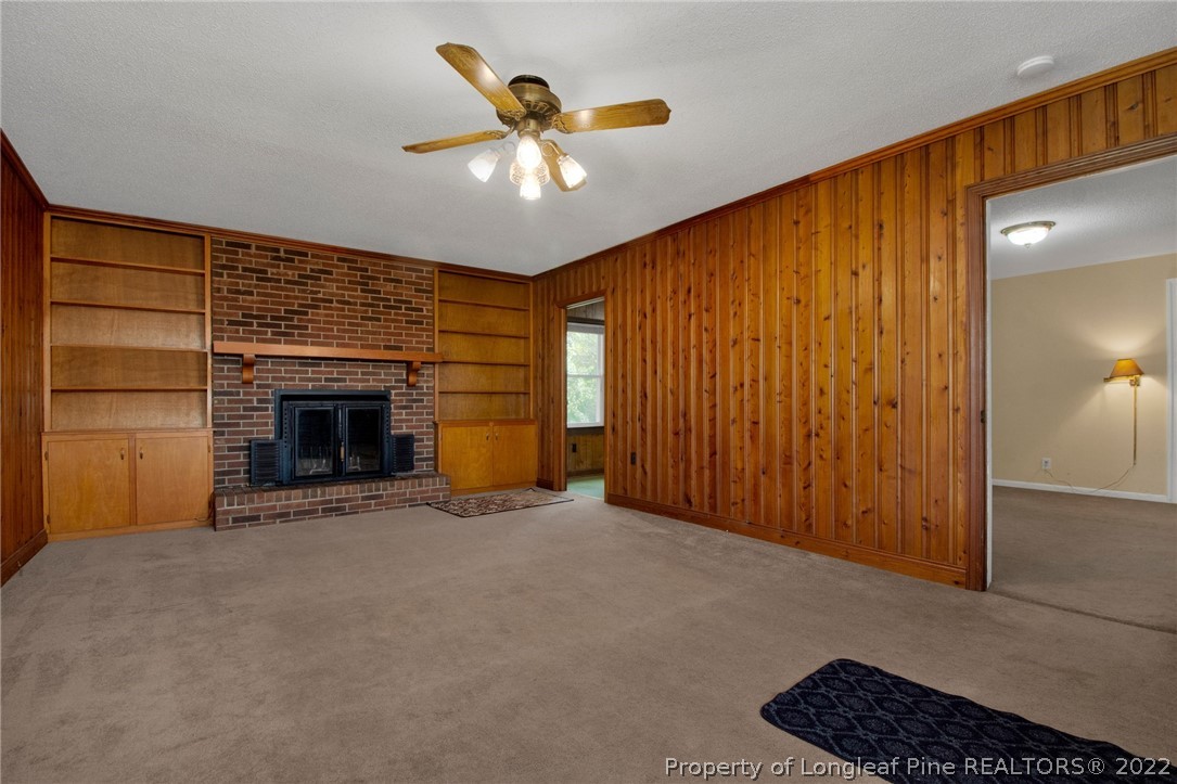 6474 Sisk Culbreth Road Godwin, NC 28344 - Photo 4 of 23 a view of an empty room with a fireplace