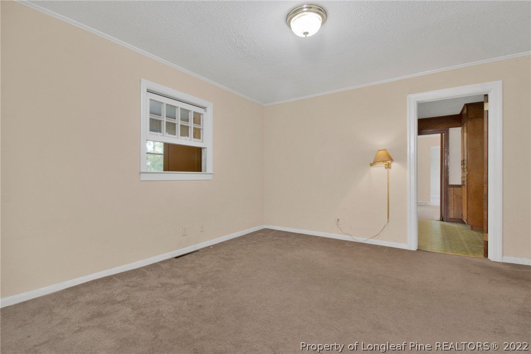 6474 Sisk Culbreth Road Godwin, NC 28344 - Photo 8 of 23 an empty room with windows