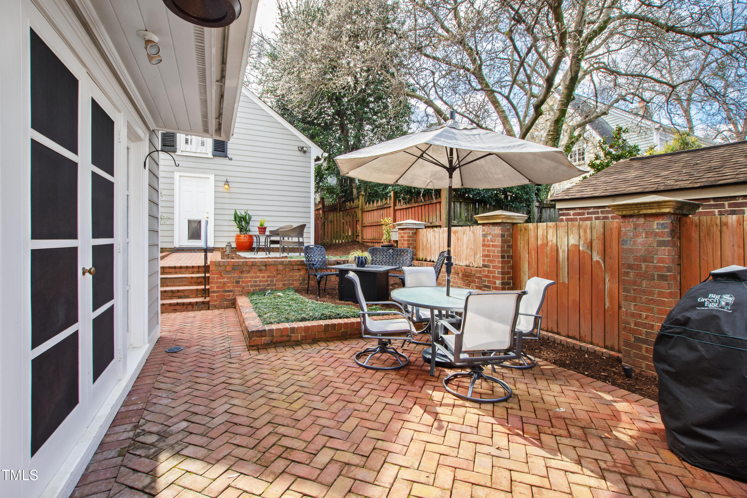2147 Wake Drive Raleigh, NC 27608 - Photo 13 of 48 a view of a chairs and table in backyard of the house