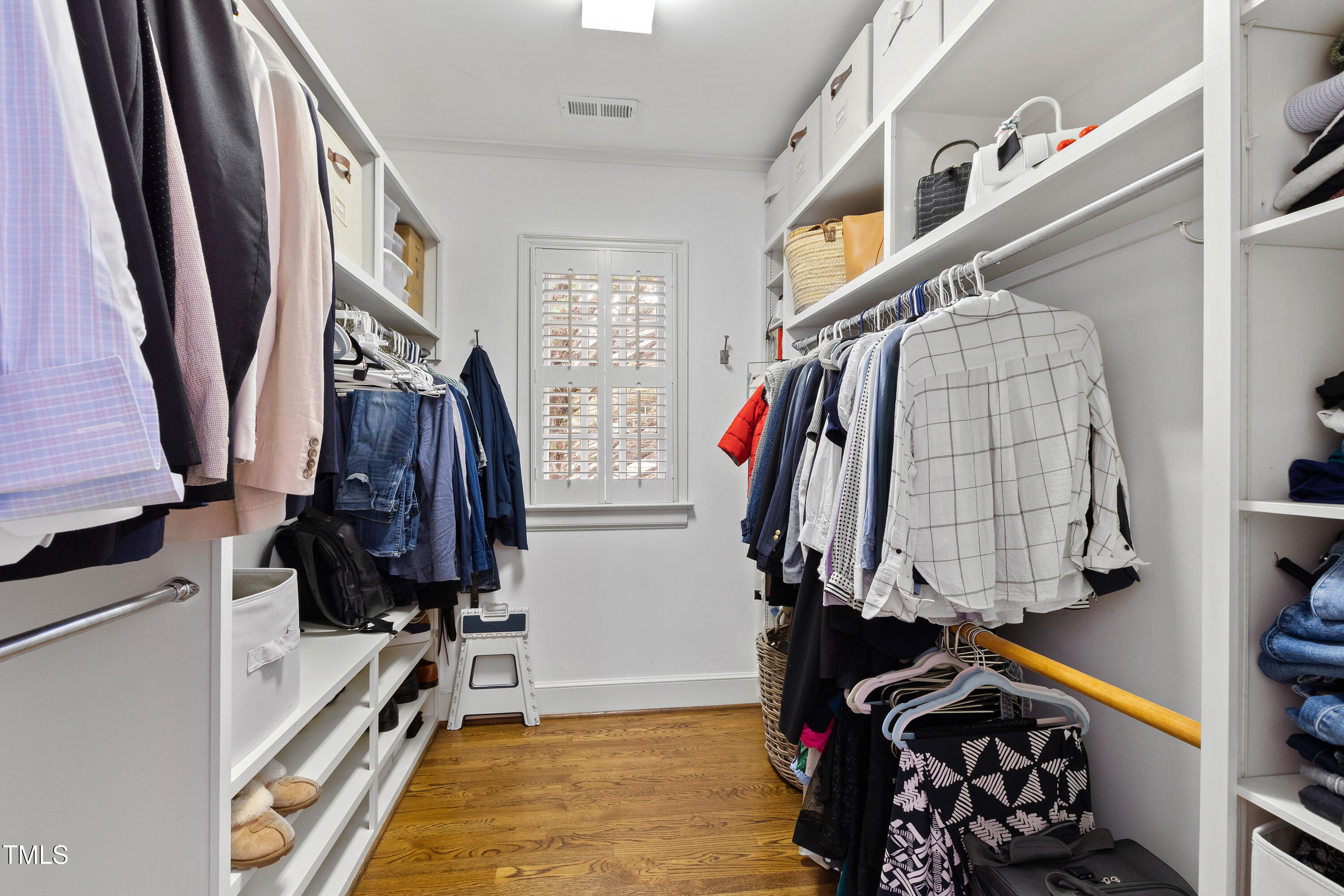 2147 Wake Drive Raleigh, NC 27608 - Photo 28 of 48 a view of walk in closet with clothes and shoes