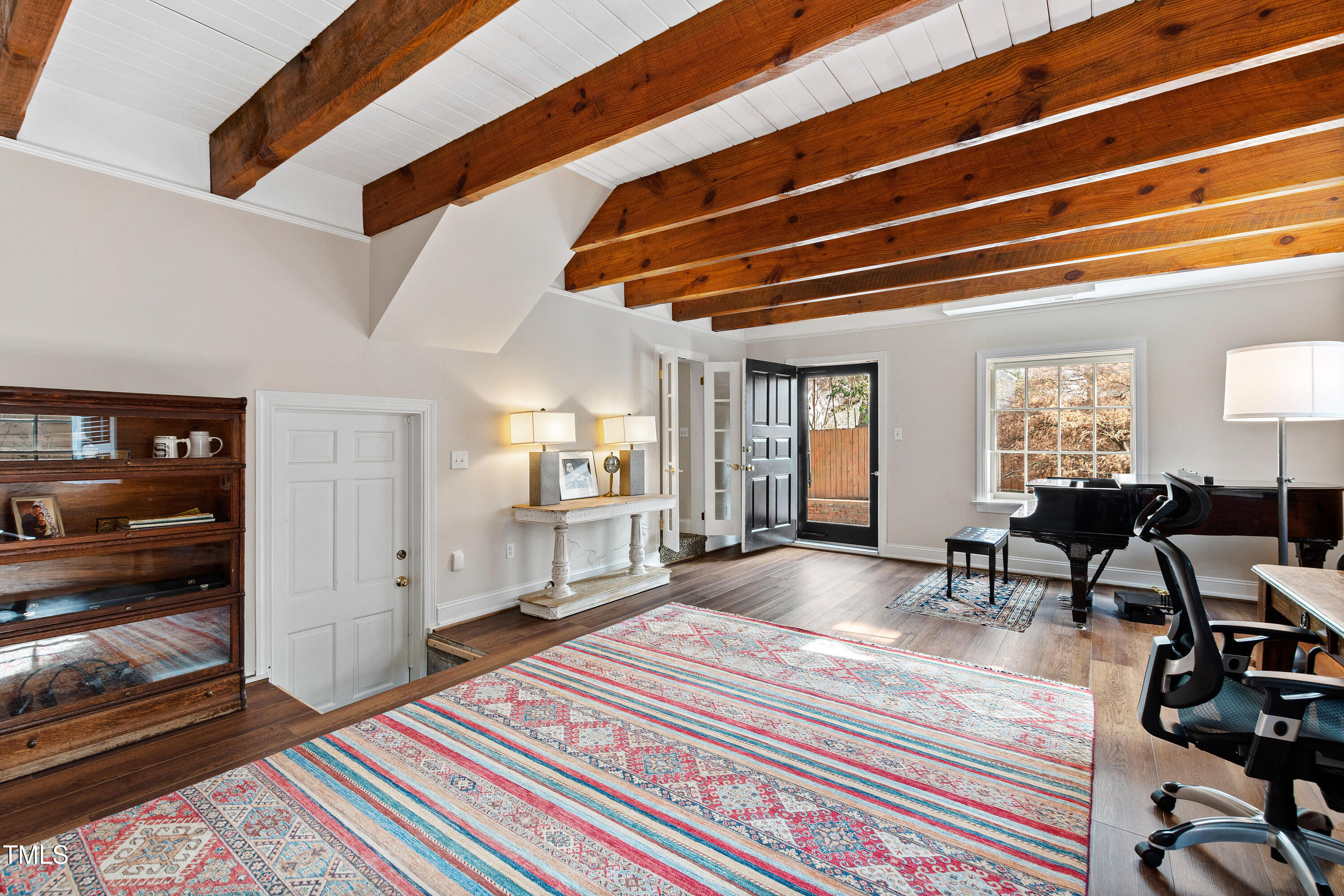 2147 Wake Drive Raleigh, NC 27608 - Photo 43 of 48 a spacious bedroom with a bed and furniture