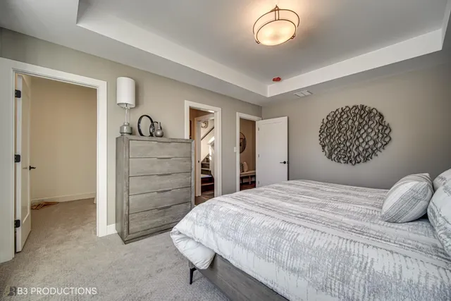a bathroom with a double vanity sink toilet and shower