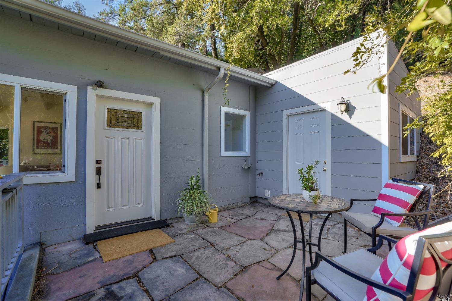 294 Scenic Road Fairfax, CA 94930 - Photo 1 of 1 a backyard of a house with outdoor seating