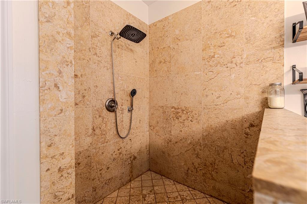 4065 10th Avenue Southeast Naples, FL 34117 - Photo 14 of 32 a bathroom with a shower