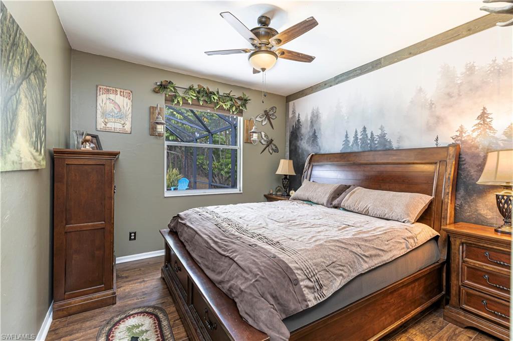 4065 10th Avenue Southeast Naples, FL 34117 - Photo 18 of 32 a bedroom with a bed and a window