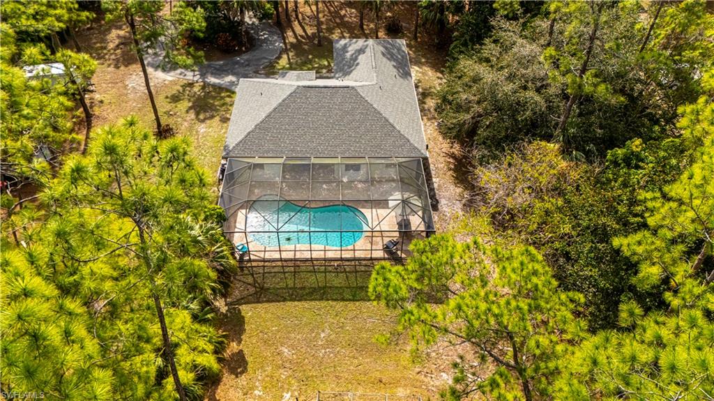 4065 10th Avenue Southeast Naples, FL 34117 - Photo 2 of 32 a view of a house with a yard