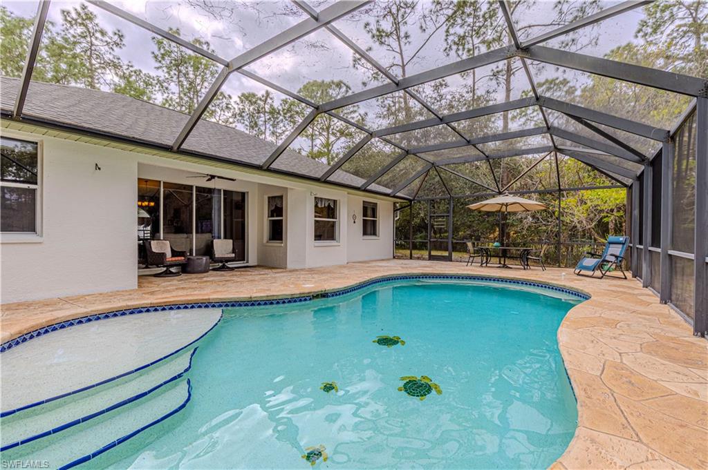 4065 10th Avenue Southeast Naples, FL 34117 - Photo 23 of 32 a view of a swimming pool with a patio