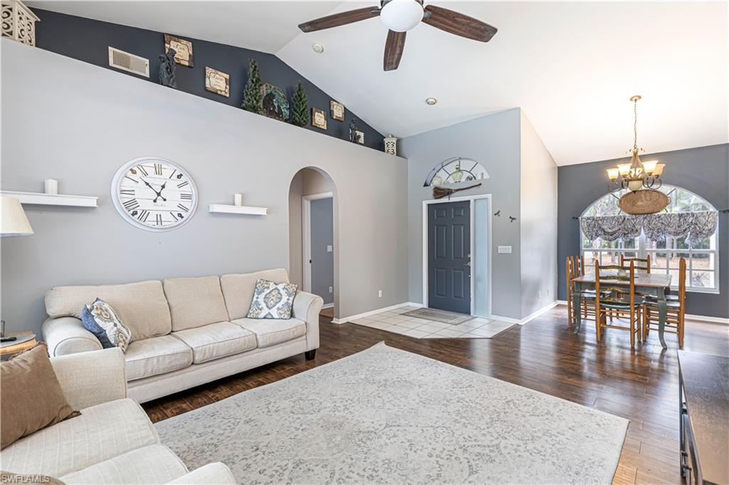 4065 10th Avenue Southeast Naples, FL 34117 - Photo 3 of 32 a living room with furniture and wooden floor
