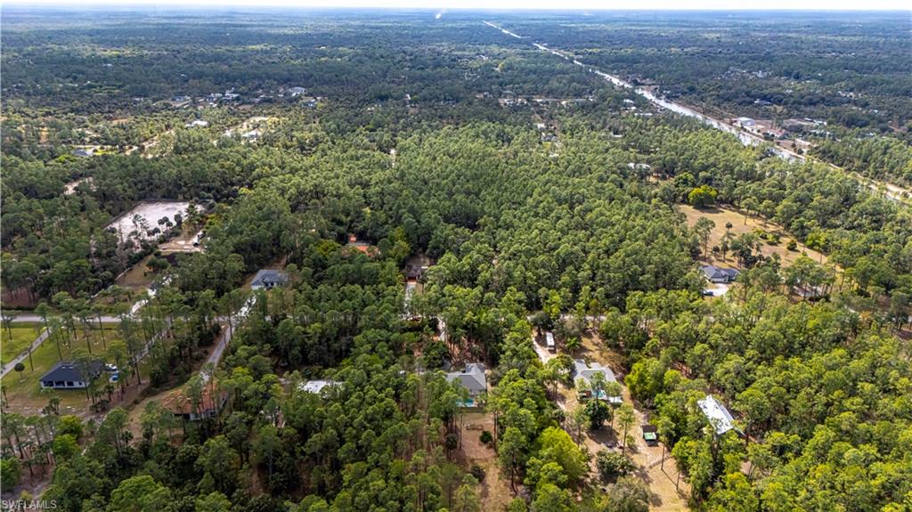 4065 10th Avenue Southeast Naples, FL 34117 - Photo 31 of 32 an aerial view of residential house with outdoor space and trees all around