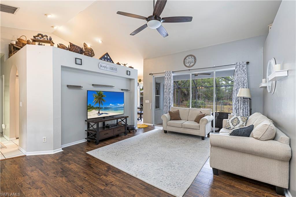 4065 10th Avenue Southeast Naples, FL 34117 - Photo 4 of 32 a living room with furniture and a flat screen tv