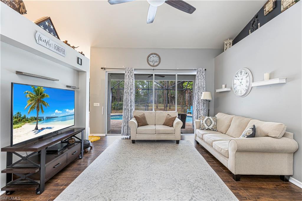 4065 10th Avenue Southeast Naples, FL 34117 - Photo 5 of 32 a living room with furniture and a flat screen tv