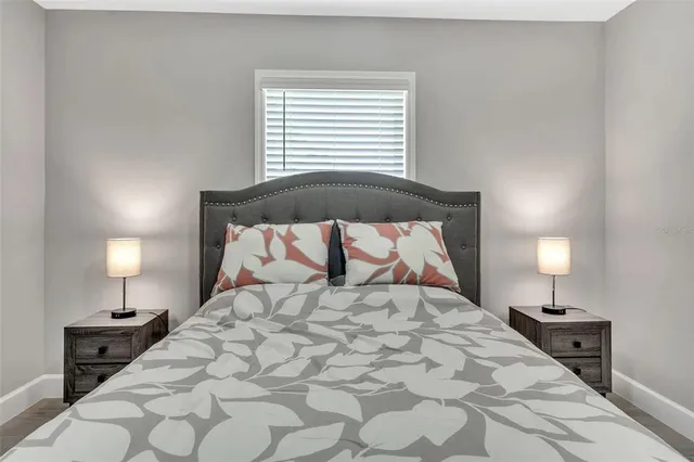 a large white bed in a white room