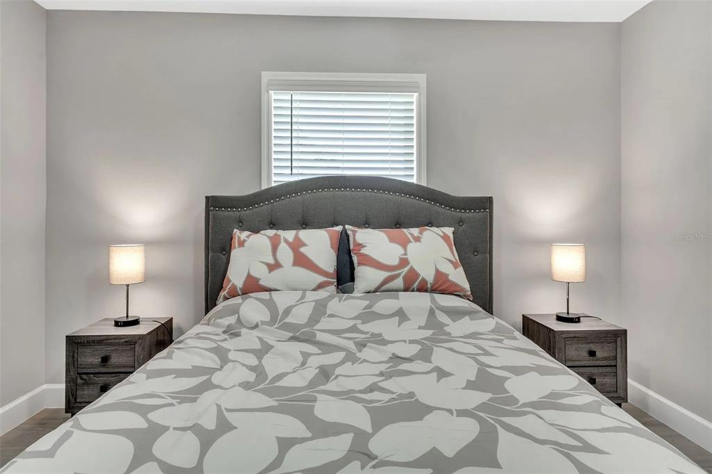 6193 Cabal Lane Port Charlotte, FL 33981 - Photo 11 of 28 a large white bed in a white room