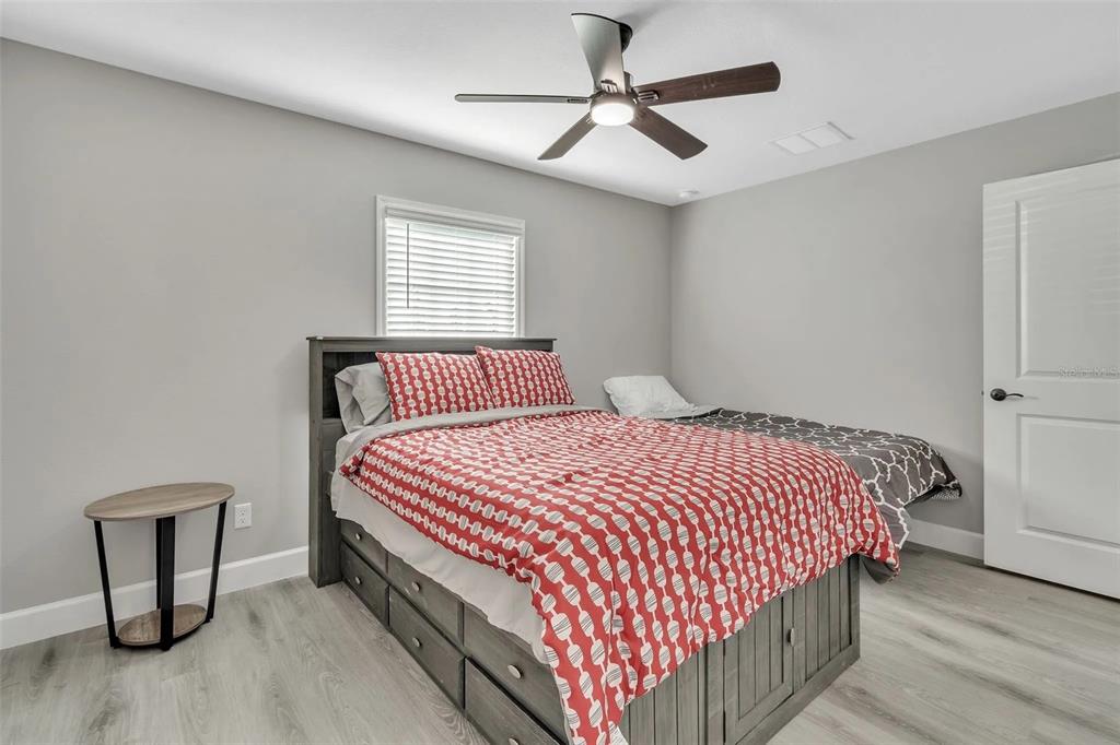 6193 Cabal Lane Port Charlotte, FL 33981 - Photo 15 of 28 a bedroom with a bed and window