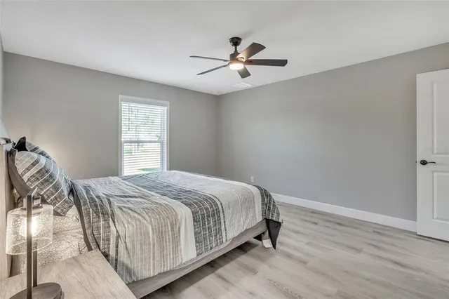 a bedroom with a bed and window