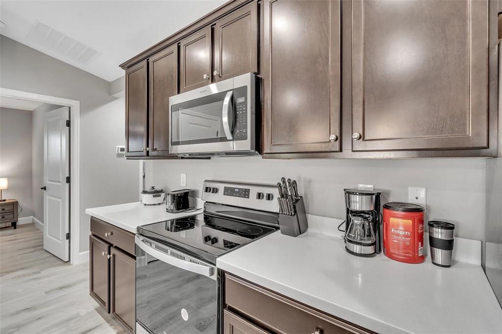 6193 Cabal Lane Port Charlotte, FL 33981 - Photo 20 of 28 a kitchen with a sink and cabinets