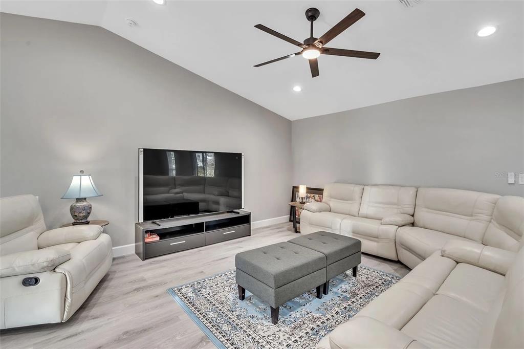 6193 Cabal Lane Port Charlotte, FL 33981 - Photo 2 of 28 a living room with furniture and a flat screen tv