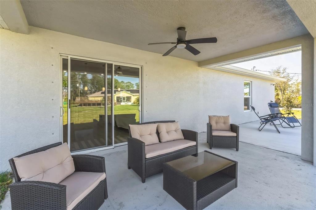 6193 Cabal Lane Port Charlotte, FL 33981 - Photo 27 of 28 a living room with furniture and a large window