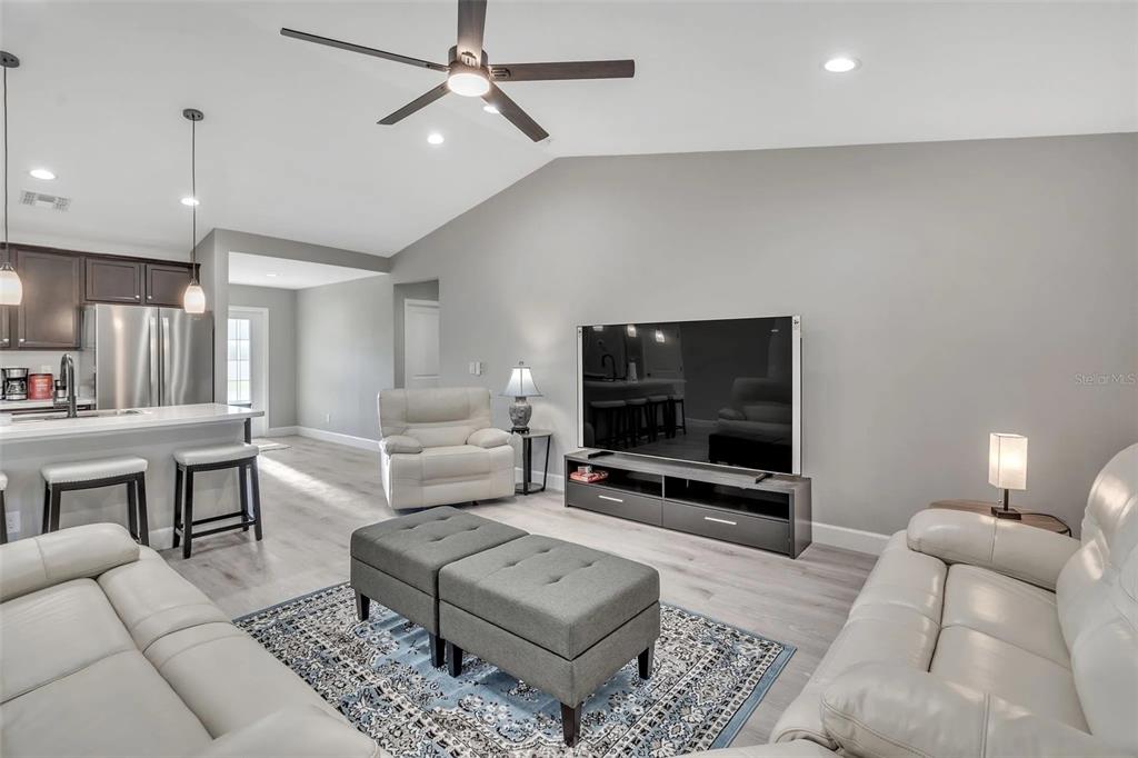 6193 Cabal Lane Port Charlotte, FL 33981 - Photo 5 of 28 a living room with furniture and a flat screen tv