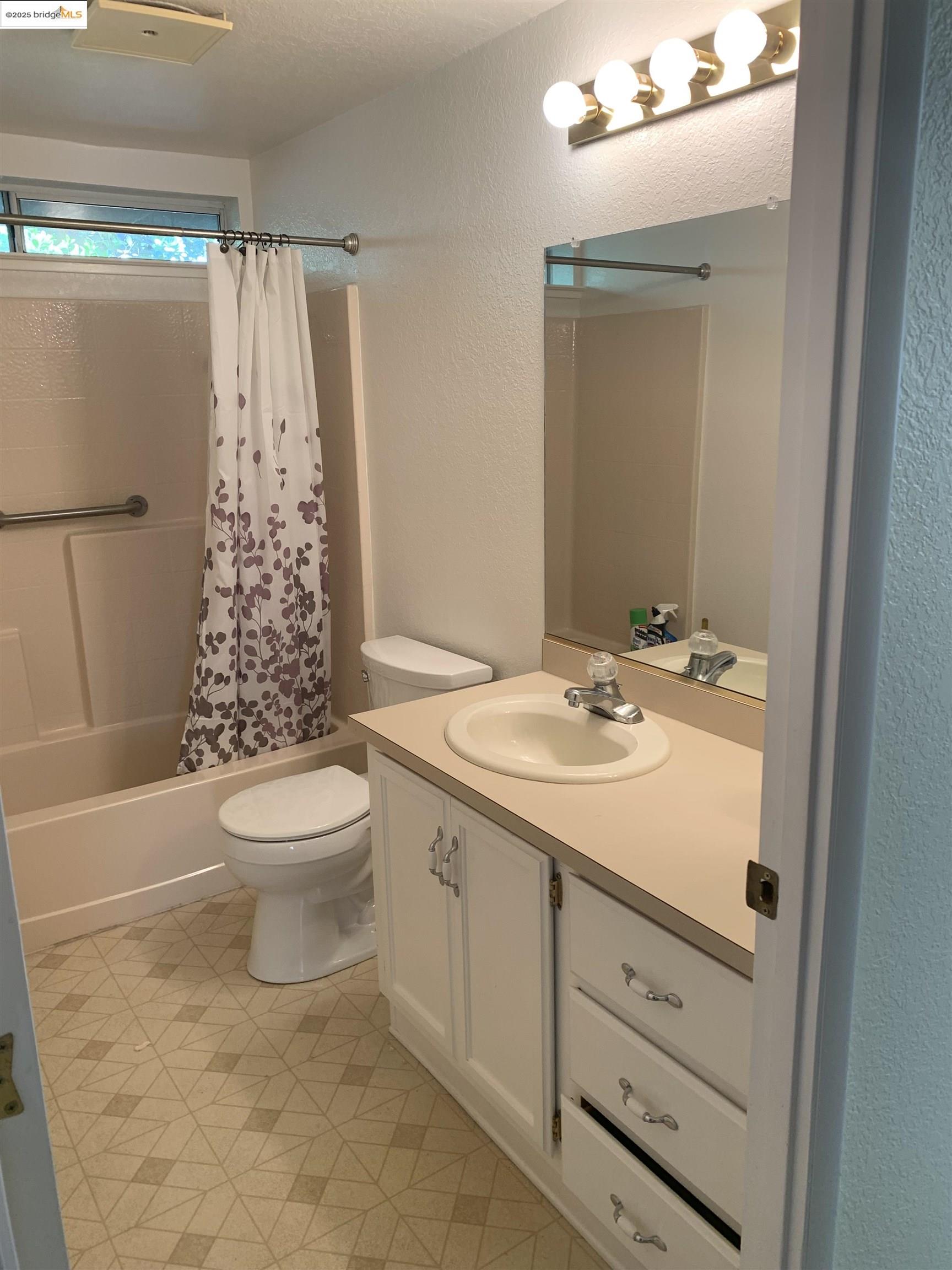 12800 Honey Locust Court, Unit 4 Sonora, CA 95370 - Photo 13 of 13 a bathroom with a sink a toilet and shower