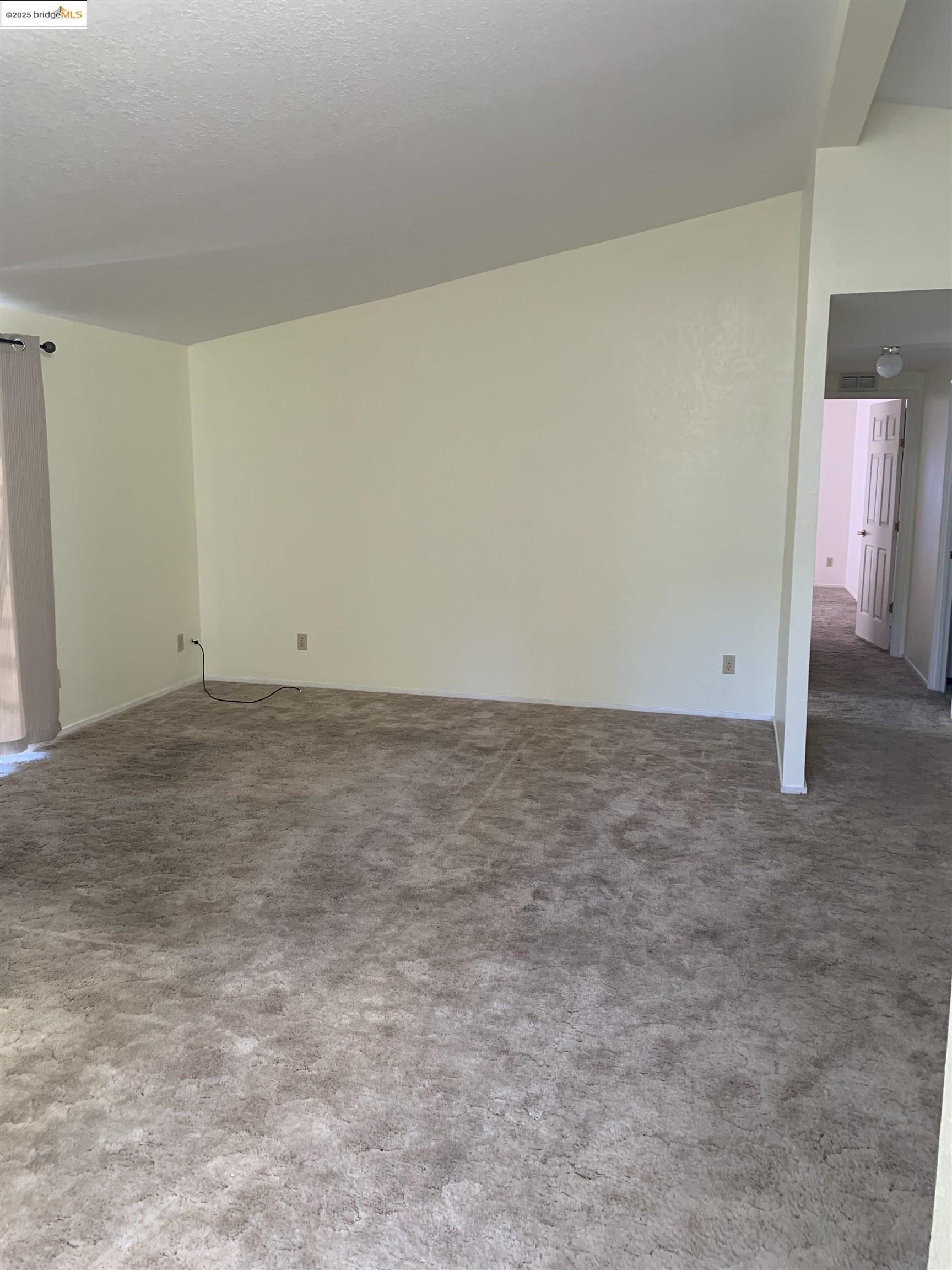 12800 Honey Locust Court, Unit 4 Sonora, CA 95370 - Photo 4 of 13 an empty room with an entryway