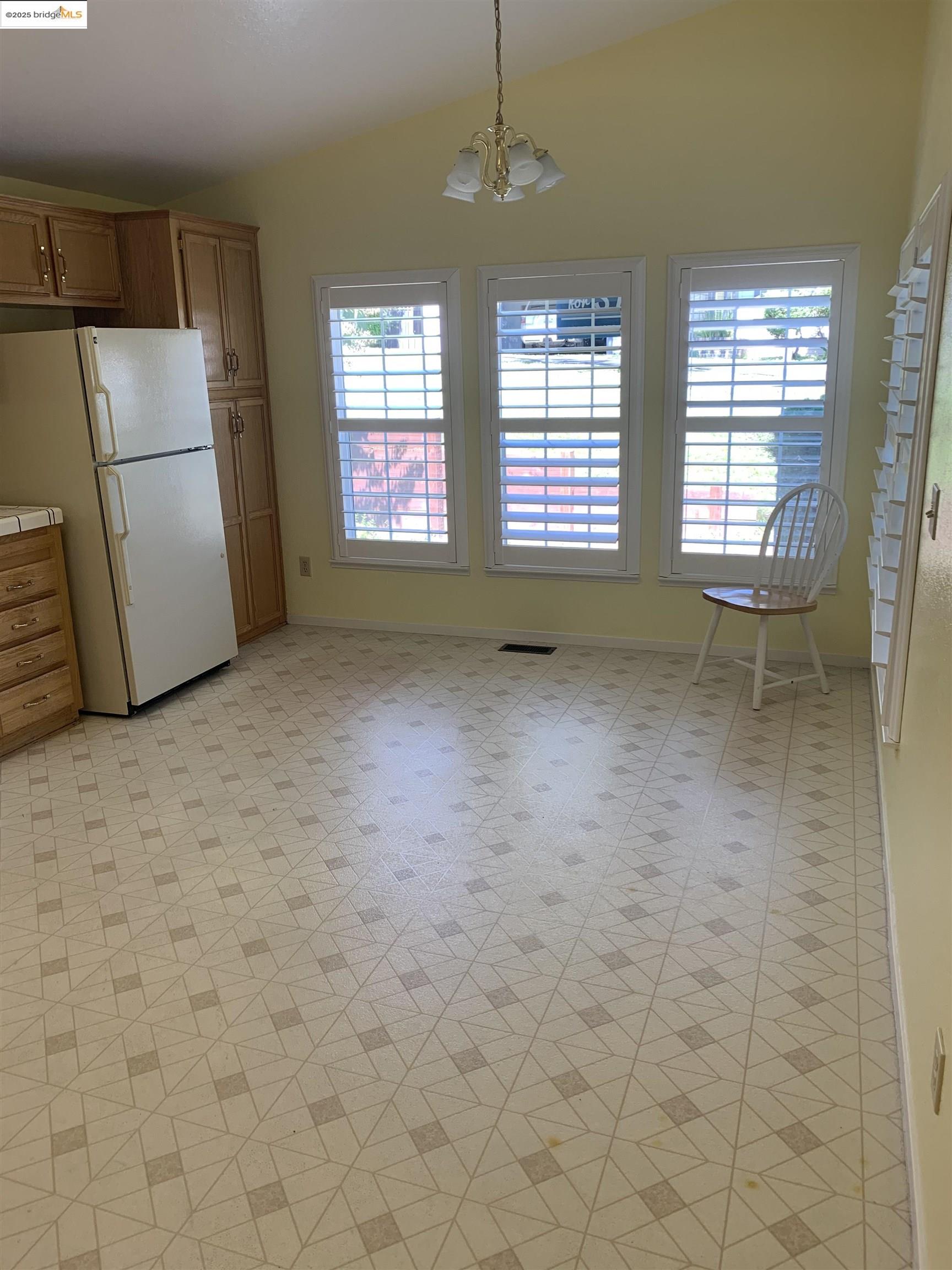 12800 Honey Locust Court, Unit 4 Sonora, CA 95370 - Photo 6 of 13 a view of an empty room with a window