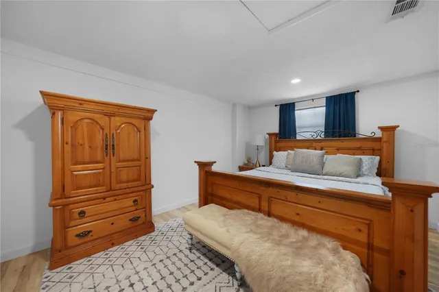 a bedroom with a bed and furniture