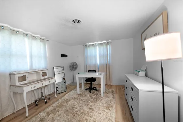 a kitchen with cabinets and window
