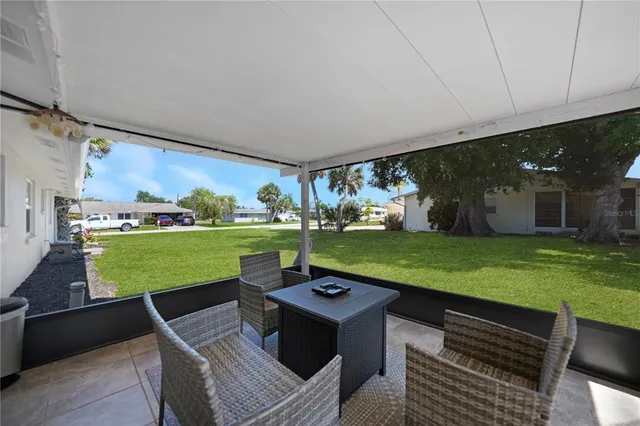 a living room with yard table and a fireplace
