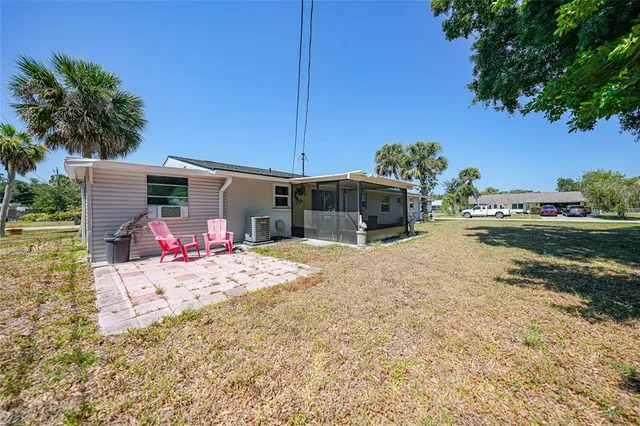 a front view of house with yard and trees